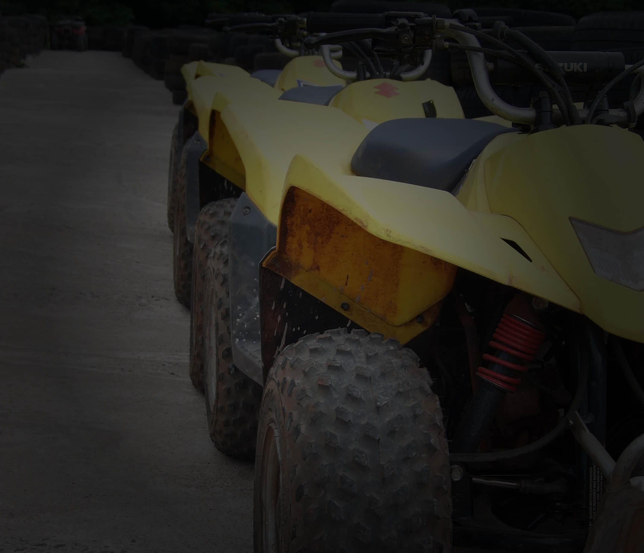 Close Up Photo of 2 quad bikes alongside the track